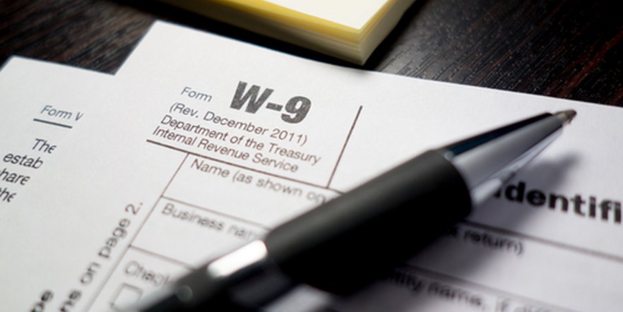 W-9 tax form and pen