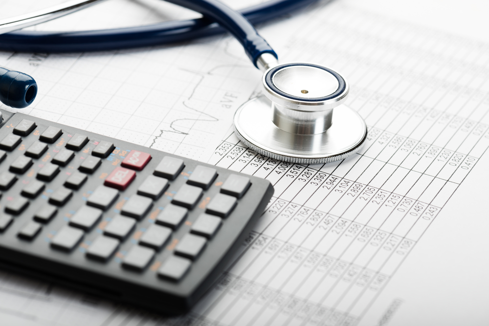 Stethoscope on a calculator and ledger