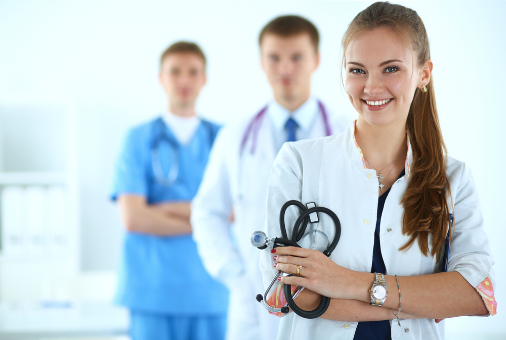 Smiling medical students in scrubs
